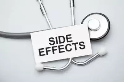 side effects sign in black and red surrounded my medical equipment