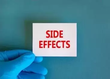 Saxenda lawsuit: Side effects symbol. White note with words Side effects, beautiful blue background