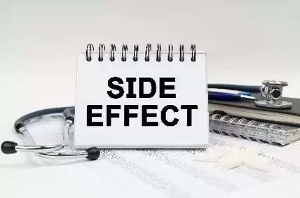 side effect on clip board in black surrounded by medical equipment
