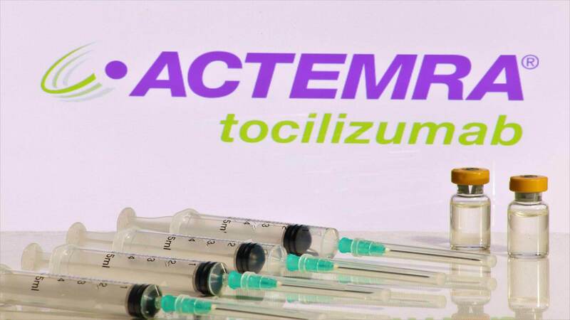 Syringes and bottle of Actemra  - Actemra written above in purple